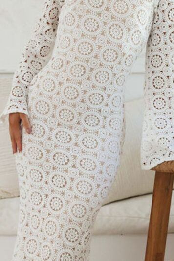Anahera White Round Floral All-over Lace Trumpet Silhouette Boho Wedding Dress with Long Bell Sleeves- close up shot by Orange Blossom Bridal
